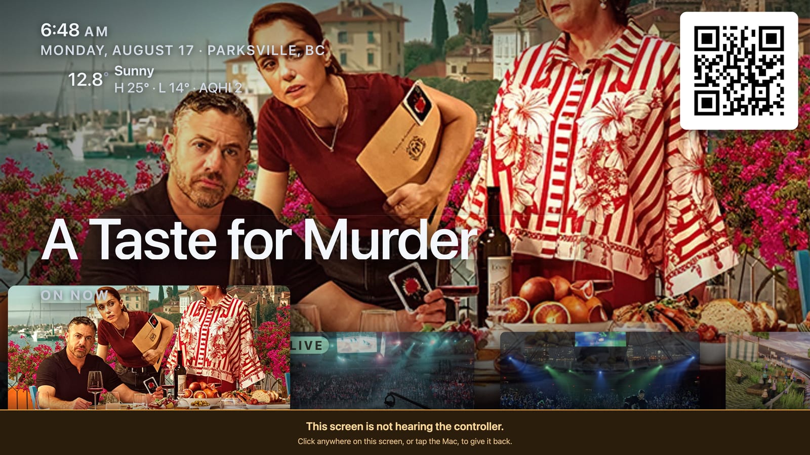 The guide on the television: a large cover image over rows of on-now tiles, with the time, the date, the town and the outside temperature set in the top corner.