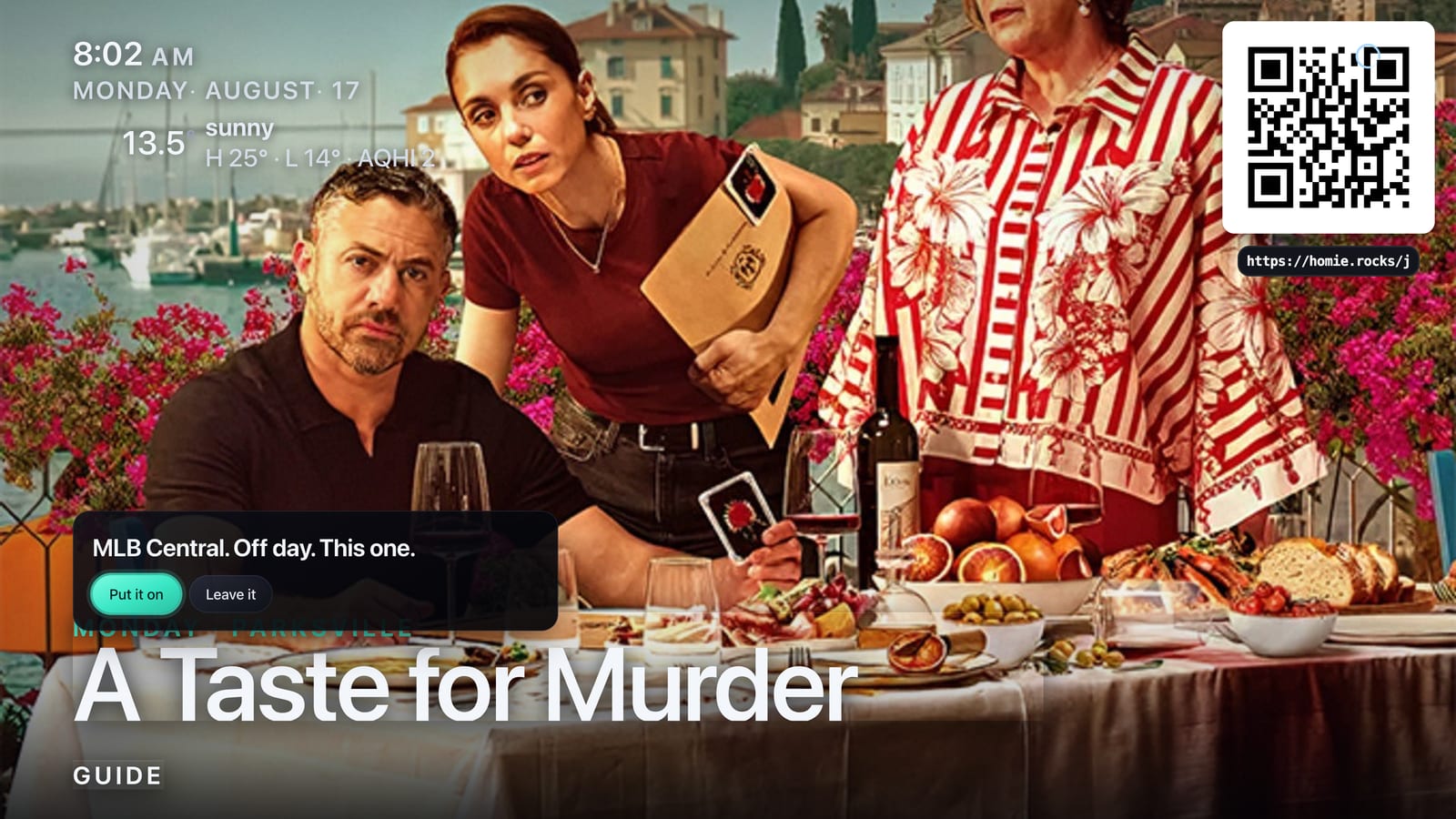 The television showing a show poster with a small spoken-request card floating over it offering two choices.