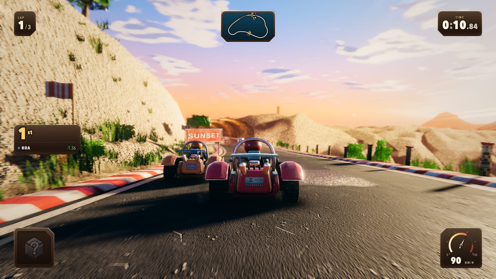 Two karts on a cliff road cut through pale rock, a SUNSET sign at the roadside and the sun low over the headlands beyond.